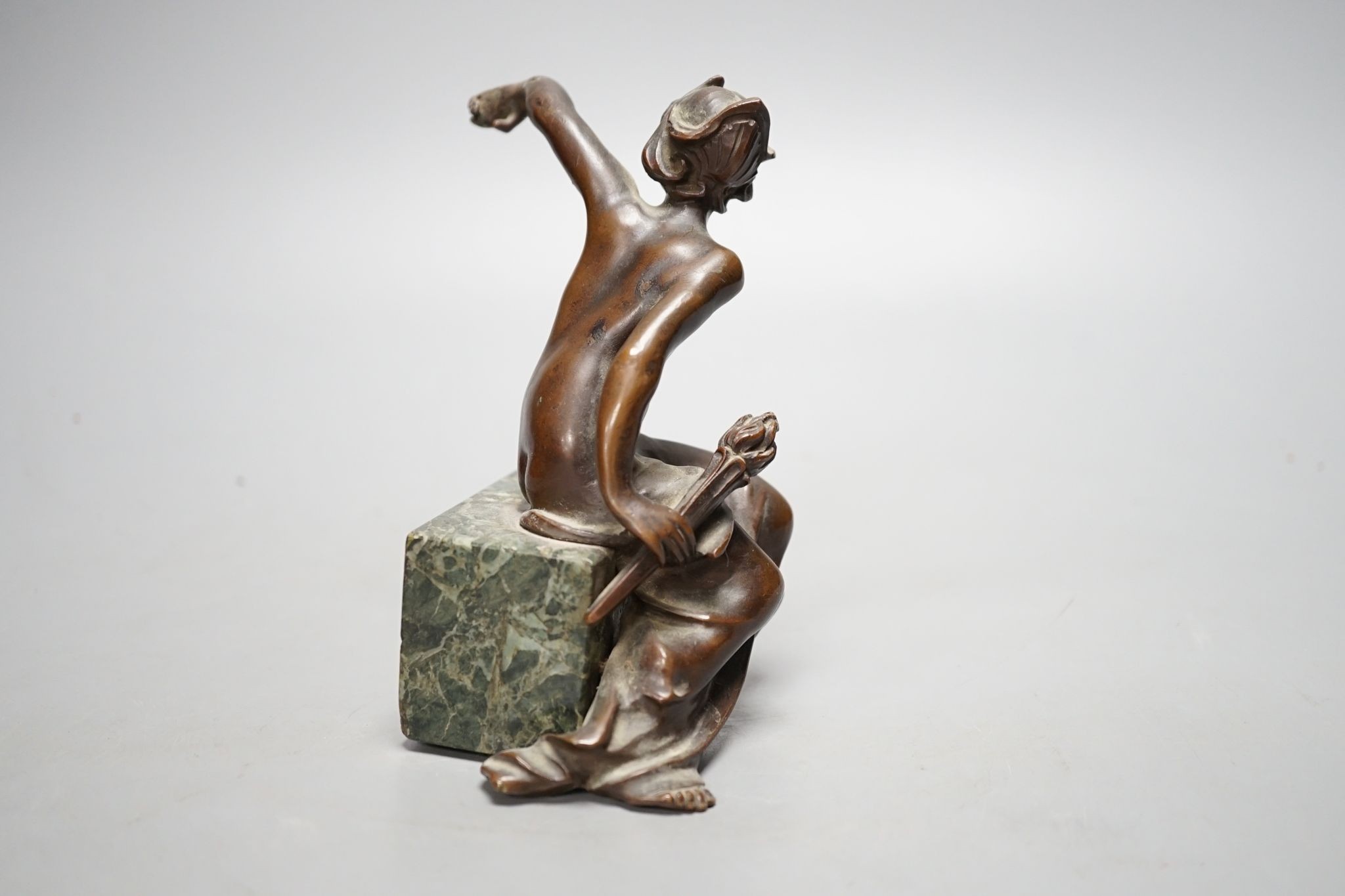An Art Deco bronze semi-nude seated female, 13 cms high.